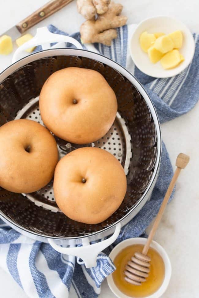 A white pot of steamed apple pears.