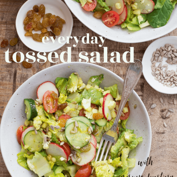 This Everyday Tossed Salad is an easy garden salad blend of mixed greens, cucumber, cauliflower, tomatoes, corn, radishes and avocado