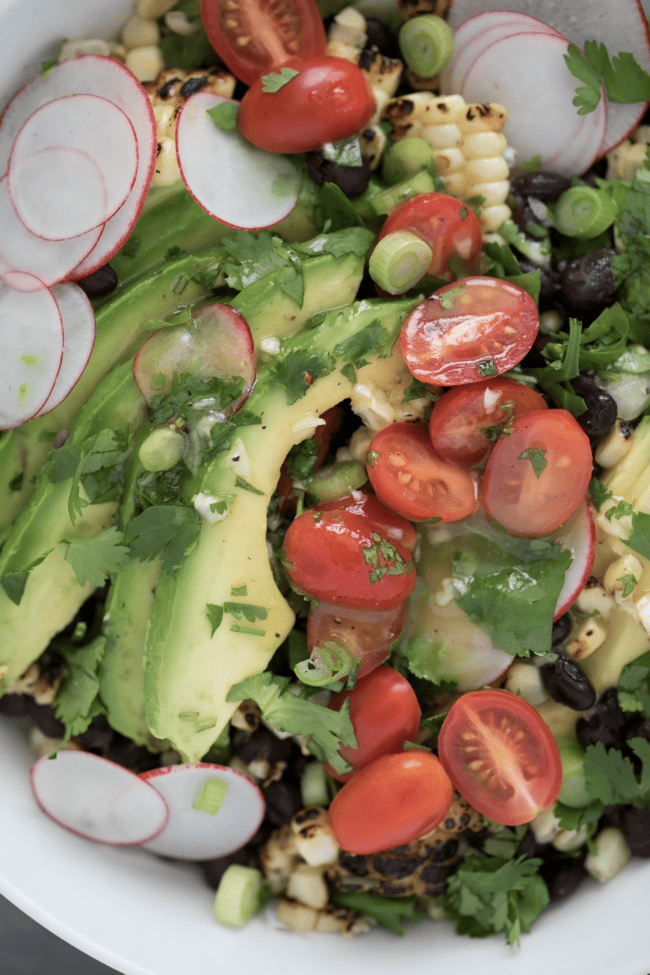 bowl of black beans and corn with avocado