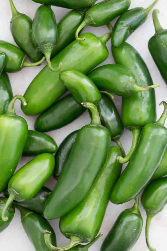 These slightly spicy Pickled Jalapenos are quick and easy to make and they're great to add to tacos, nachos, burgers and more