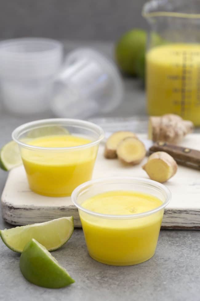 Small plastic containers of pineapple drinks.