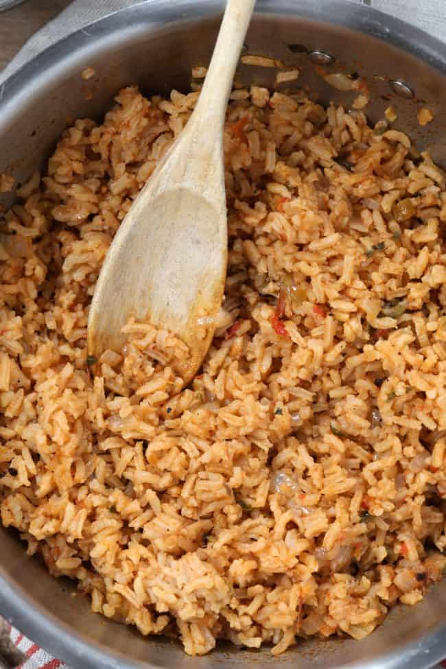 A pot of fluffy cooked grains.