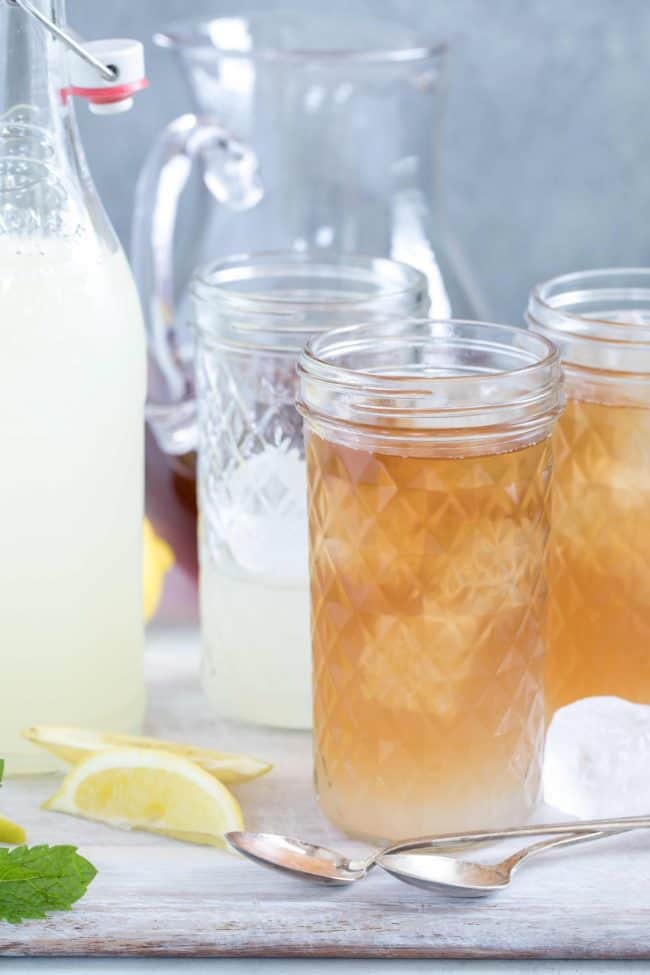 Clear drinking glasses filled with homemade Arnold Palmer Tea . 
