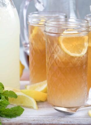 Clear drinking glasses filled with lemonade and tea