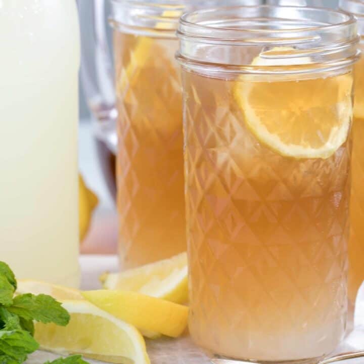 Clear drinking glasses filled with lemonade and tea