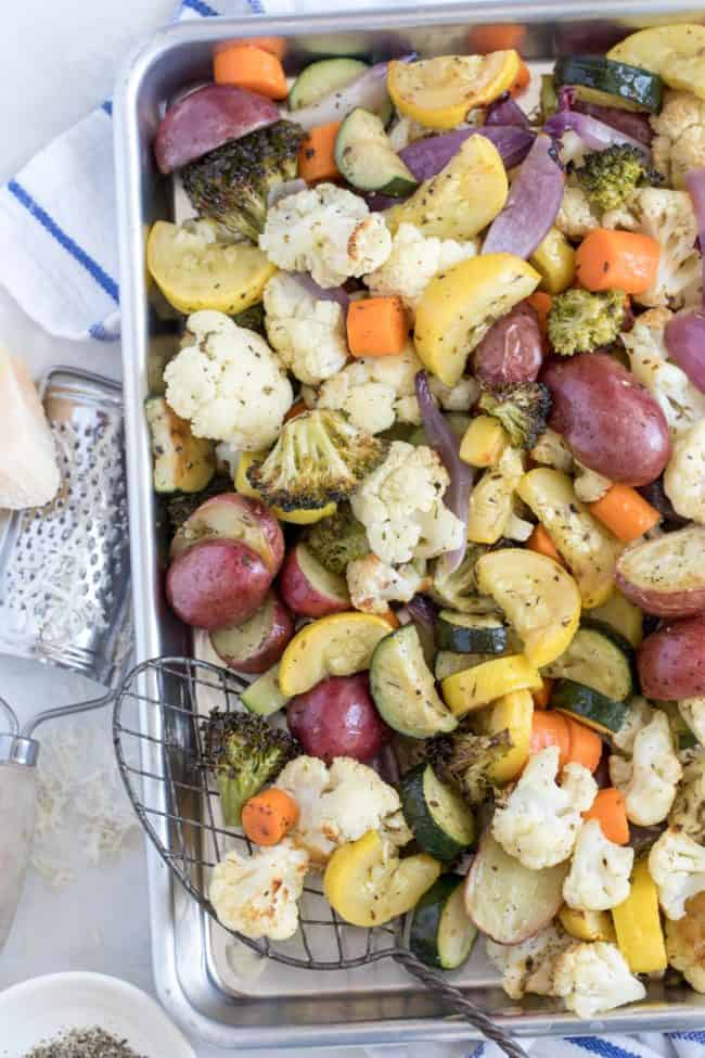 A cookie sheet filled with roasted vegetables