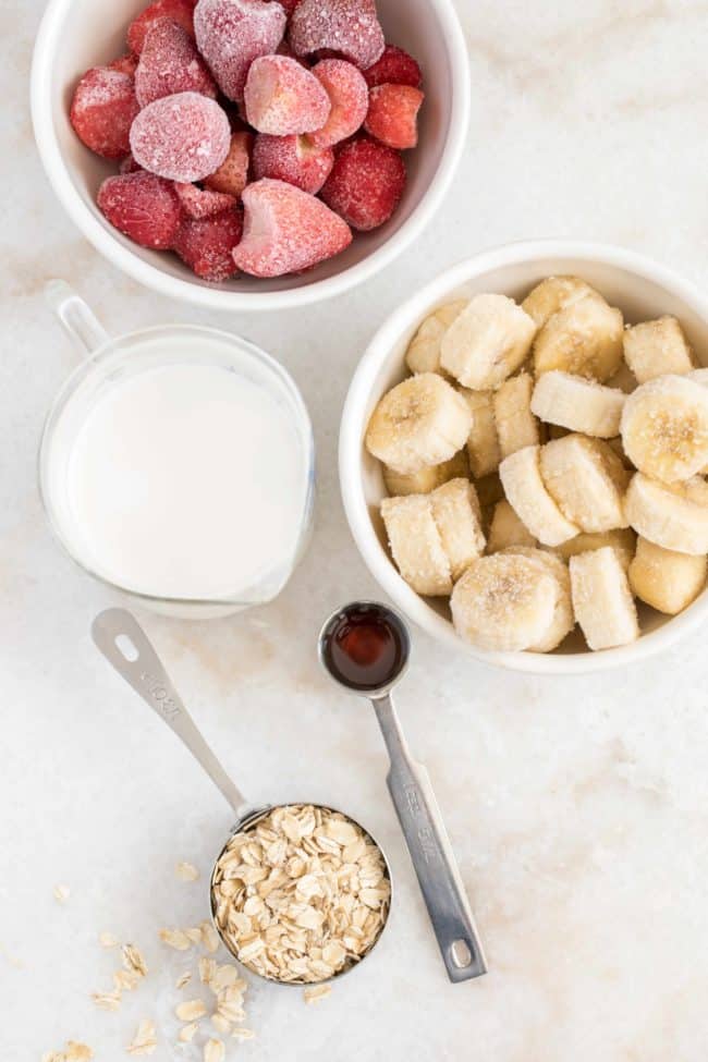 bowls of fruit with strawberries and bananas