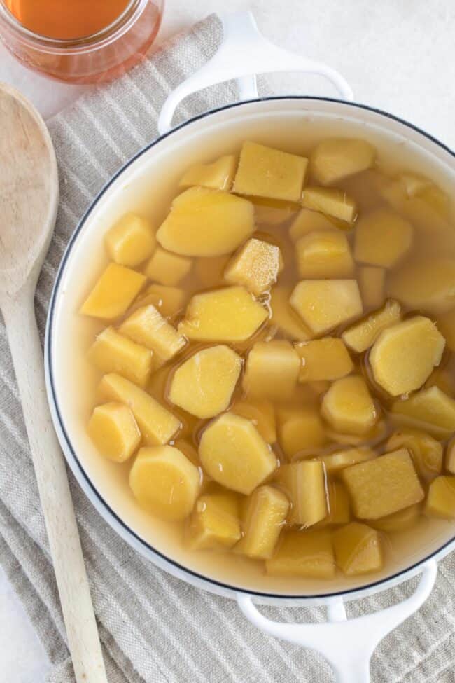 A white pot of cooked ginger root.