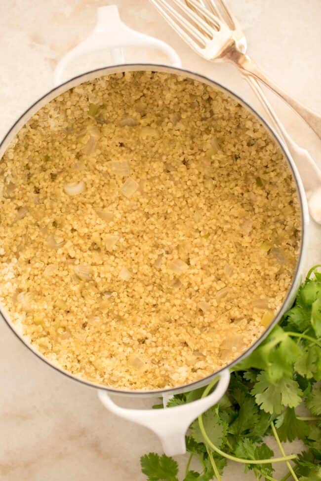 white pot filled with cooked quinoa