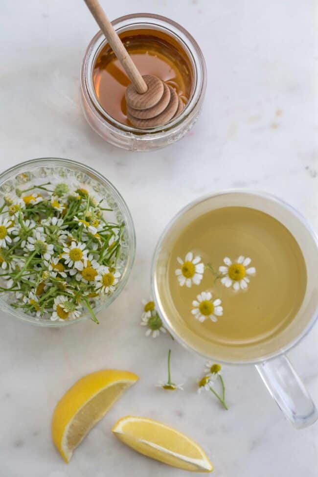 chamomile flowers and cup of chamomile tea