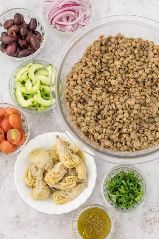 bowls of lentils, olives, onion, cherry tomatoes