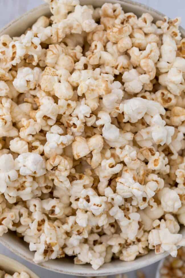 A white bowl filled with homemade kettle corn popcorn (sweet and salty popcorn).