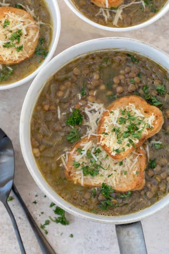 A white pot filled with French Lentil Soup.