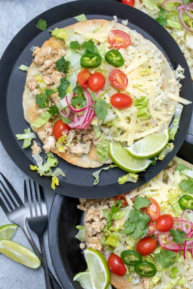 Three Plates filled with chicken tostada (tostadas de pollo).