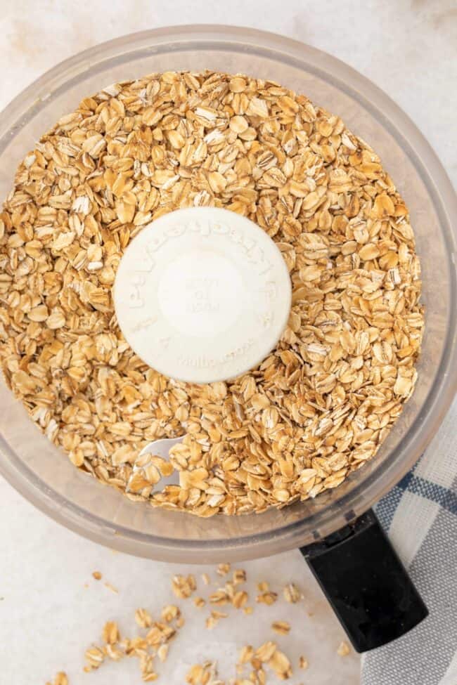 A food processor filled with old fashioned oats.