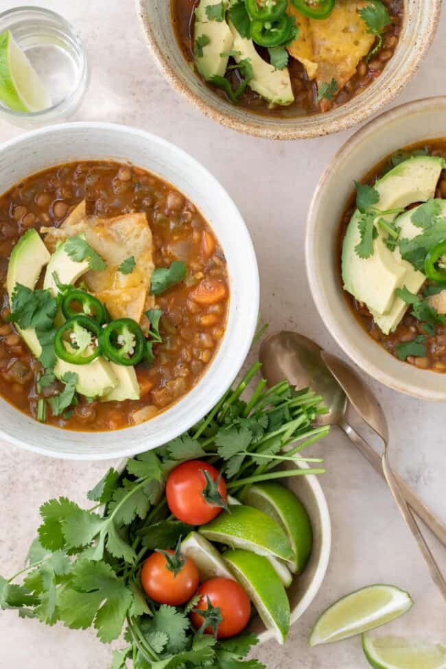Three bowls of Mexican lentil soup.