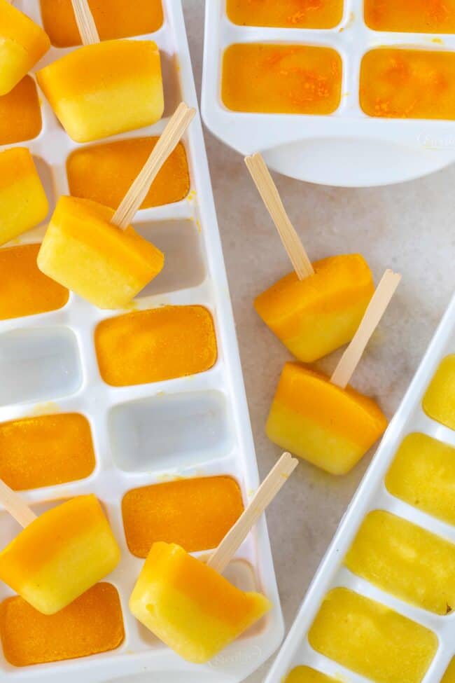 White trays filled with frozen fruit .