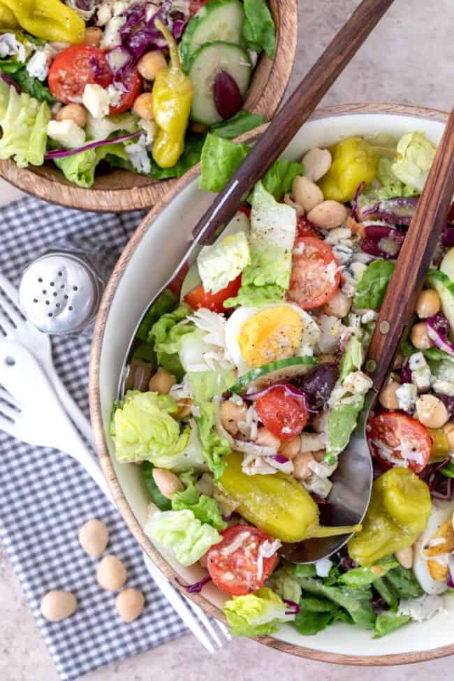 two bowls of chef salad tossed in gorgonzola dressing (for chef salad recipe)