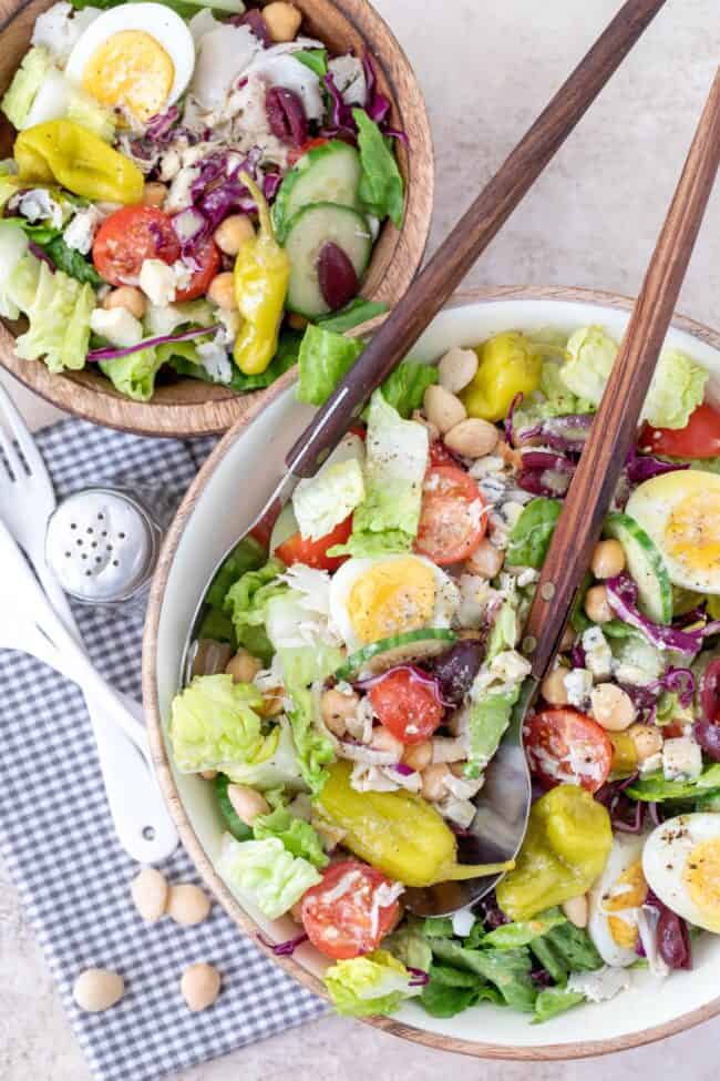 Two bowls of tossed chef salad.