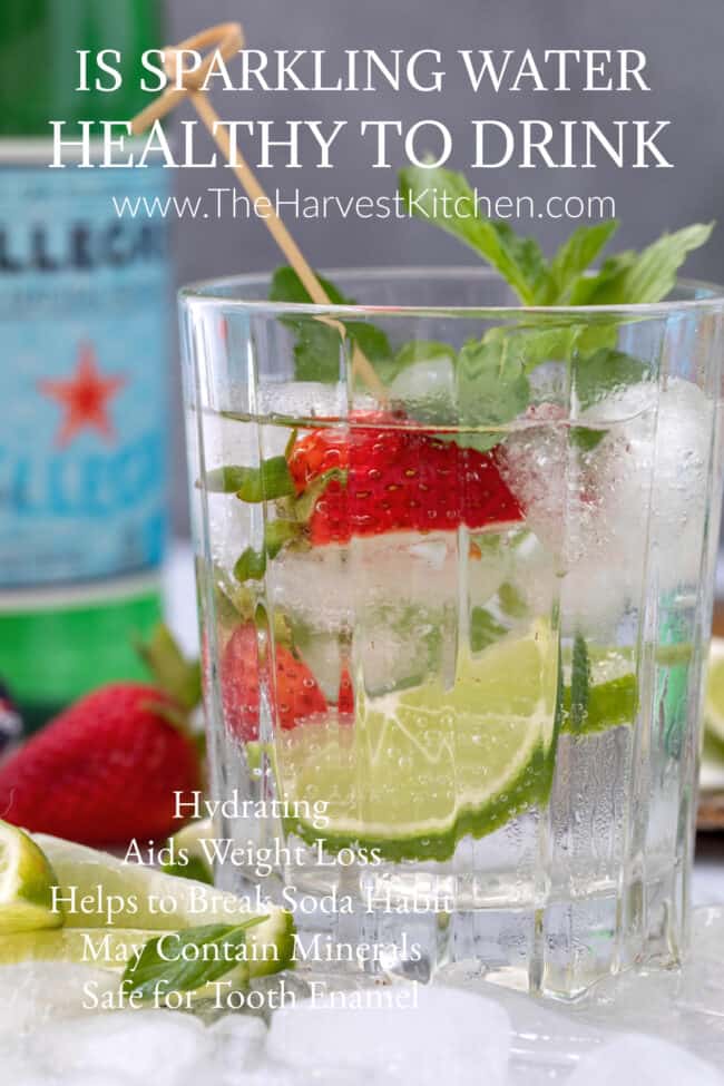 drinking glass filled with sparkling water and fruit