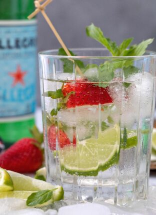 A clear drinking glass filled with sparkling water for seltzer vs sparkling water.