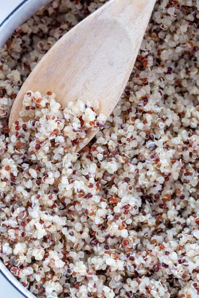 A white pot of cooked ancient grains.