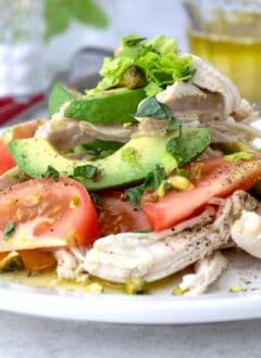 plate of chicken and avocado