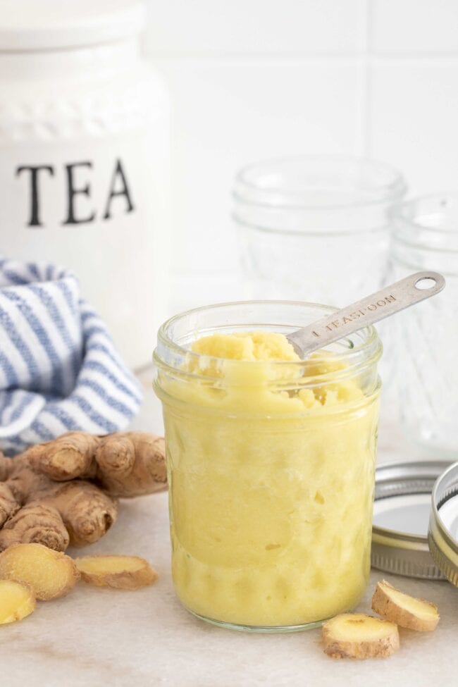 A clear glass mason jar filled with mashed root.