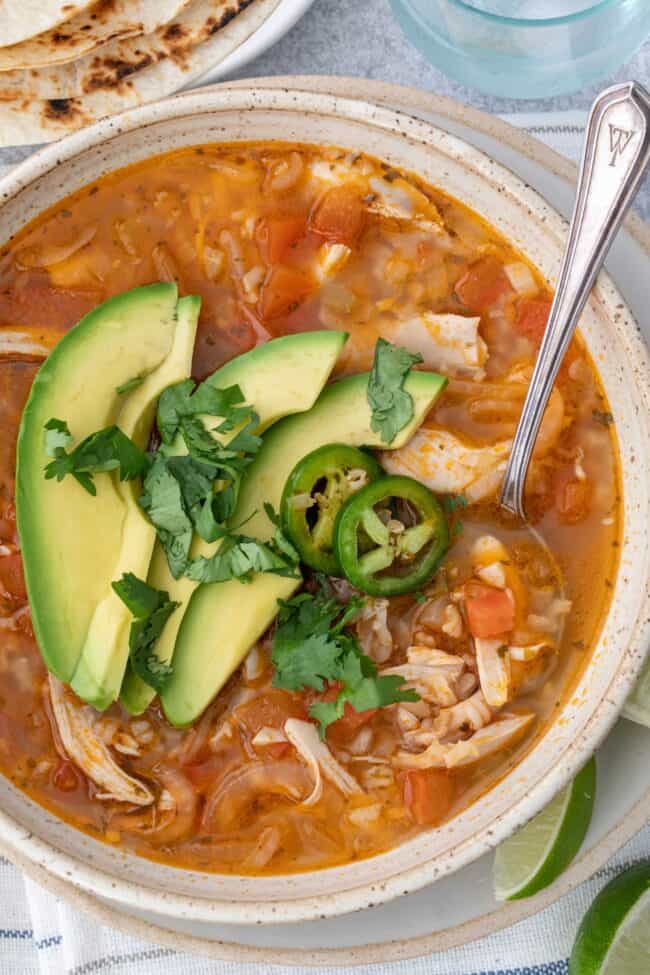 A bowl of chicken and rice soup.