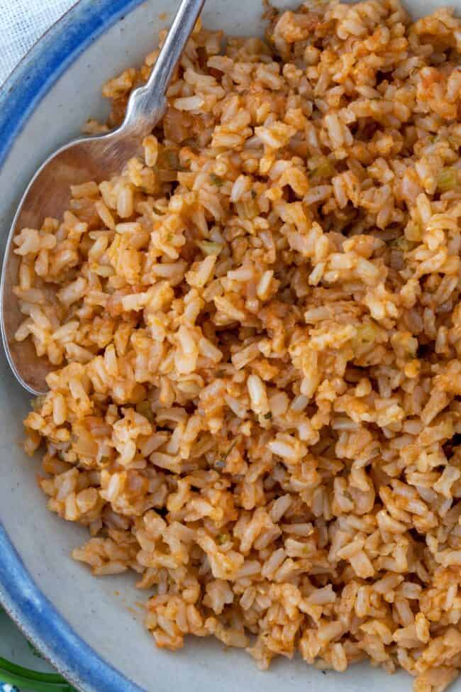 A white bowl of cooked Mexican brown rice.