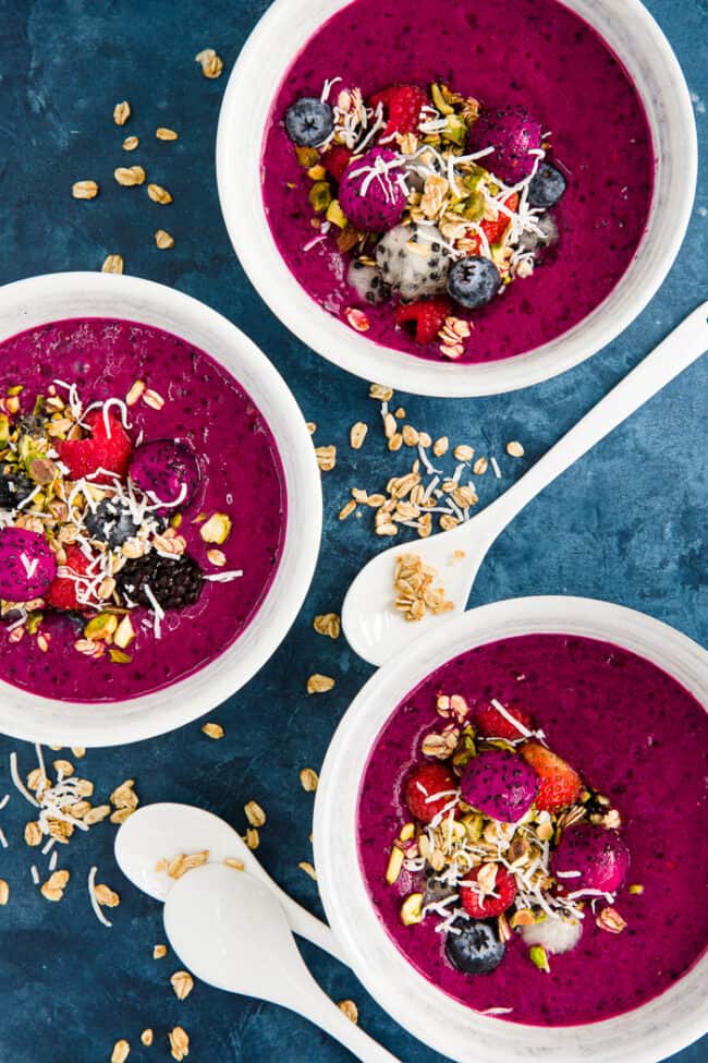 3 white bowls filled with blended fruit.
