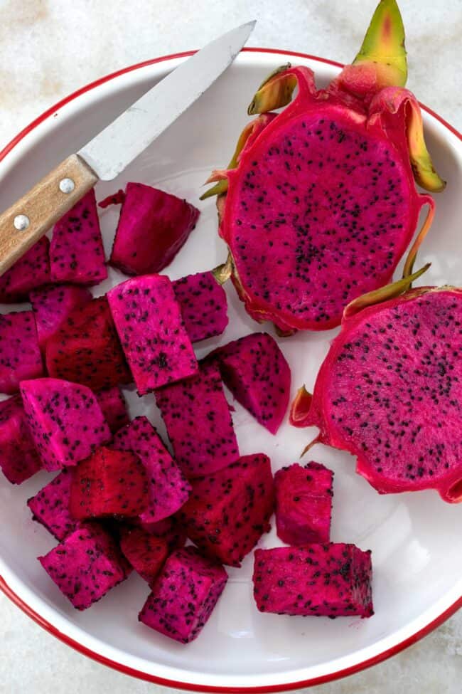 white plate with chunks of red dragon fruit 