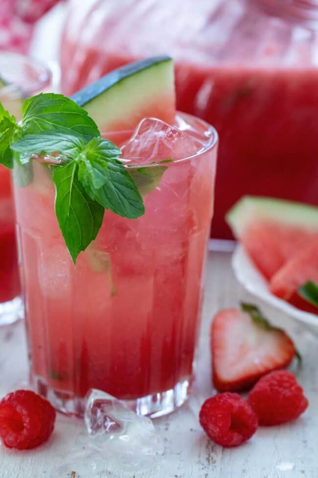 A clear drinking glass of fresh watermelon juice.