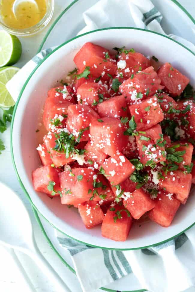 white bowl filled with watermelon salad