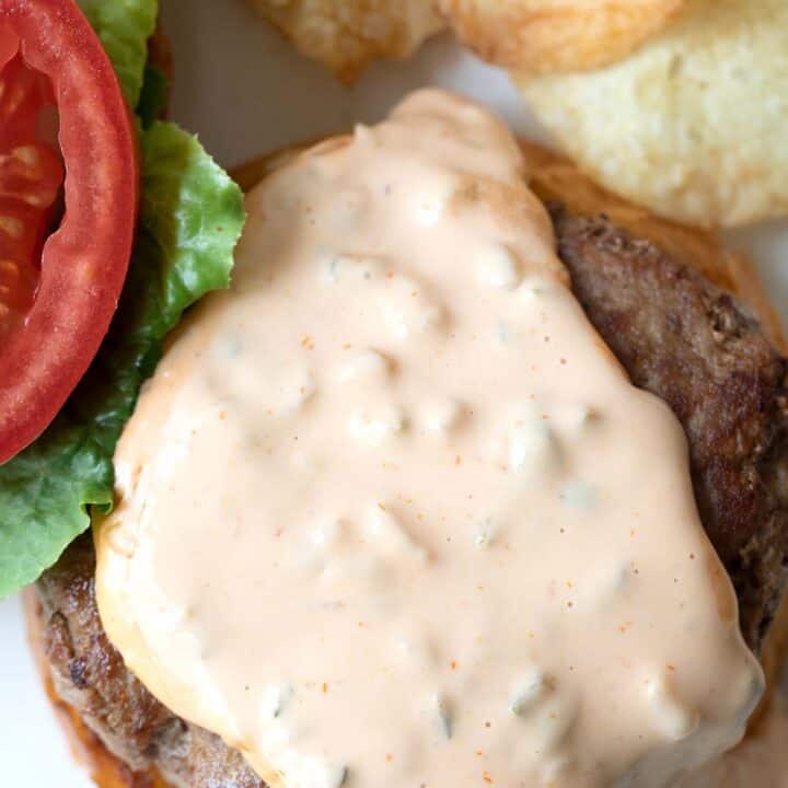 cooked hamburger with burger sauce