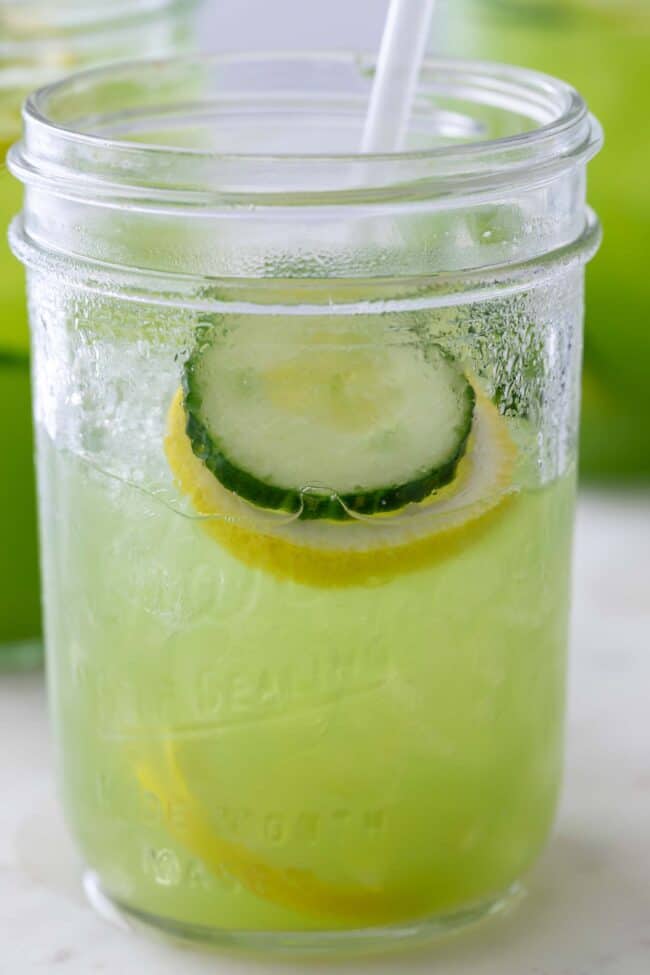 clear mason jar filled with light green juice