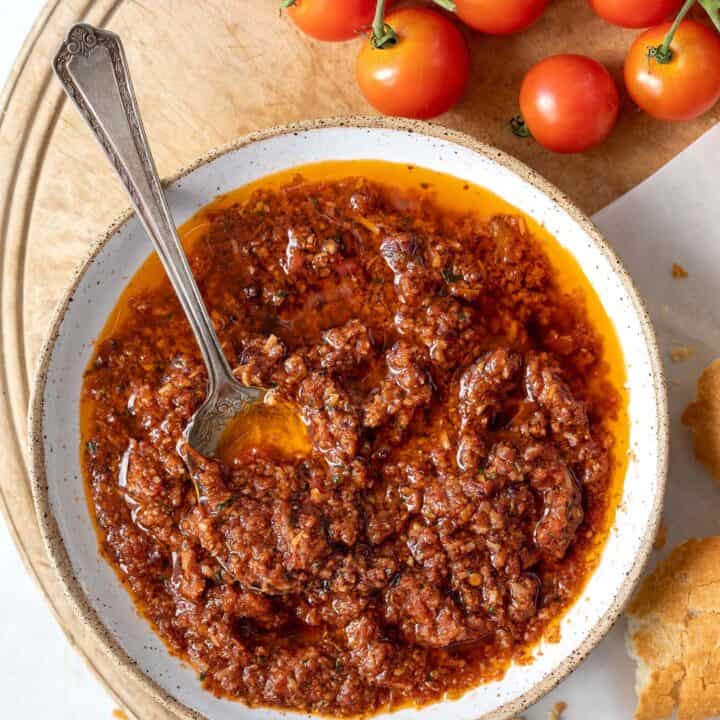 White bowl filled with sun-dried tomato pesto