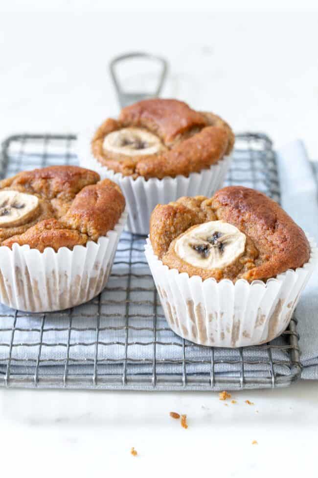 Muffins sitting on a silver wire cooling rack