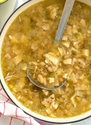 Pot of White Bean Chicken Chili with a ladle in the pot