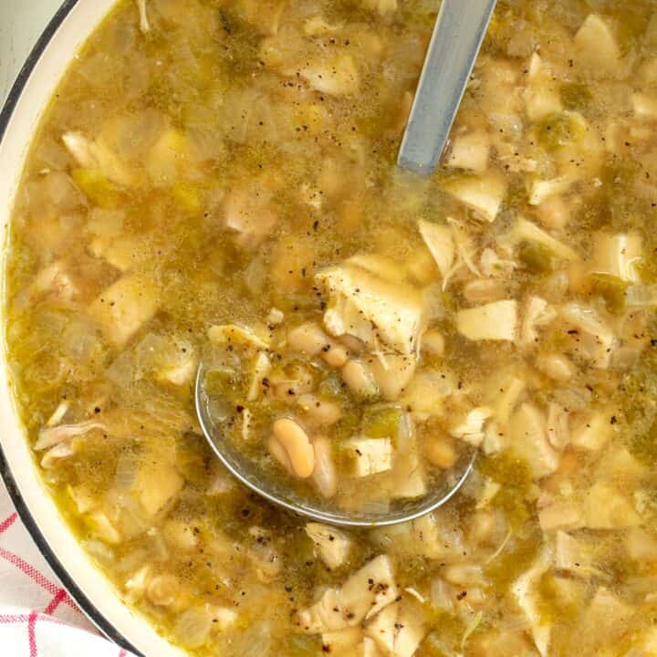 Pot of White Bean Chicken Chili with a ladle in the pot.