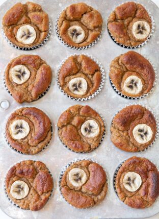 A silver muffin tin filled with Gluten Free Banana Muffins.