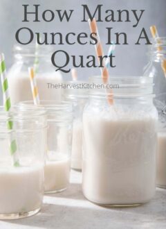 Clear mason jars filled with almond milk to measure how many ounces in a quart (qt to oz)