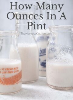 Old glass pint milk bottles filled with almond milk.