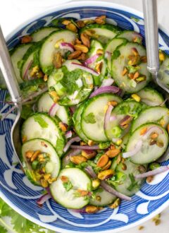Blue and white bowl filled with cucumber salad