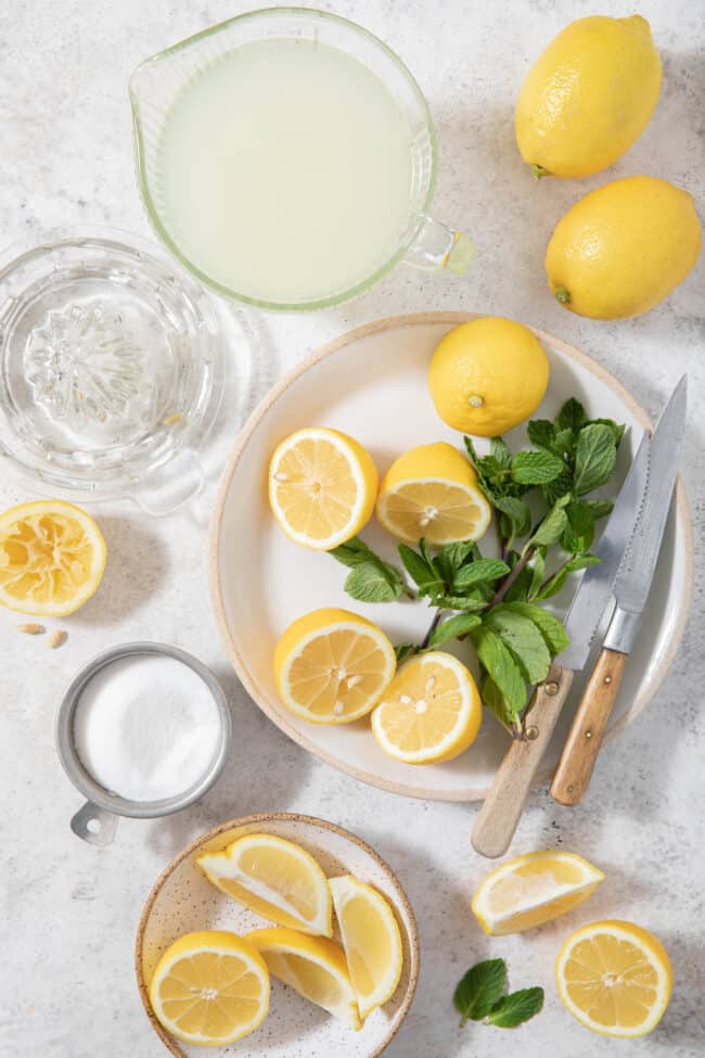 Glass measuring cup filled with lemonade to measure how many ounces in a cup