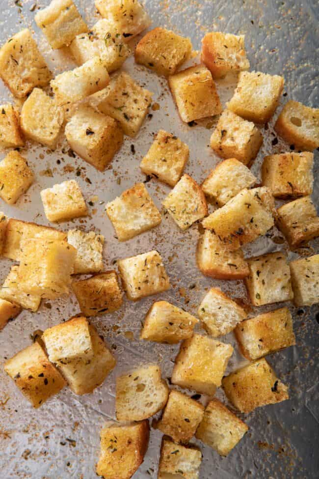 a cookie sheet filled with homemade croutons