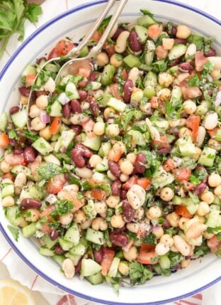 blue and white bowl filled with bean salad
