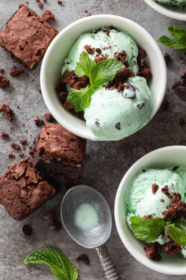Three small white bowls filled with mint chocolate chip ice cream with brownies crumbled on top - for how many pints in a gallon.