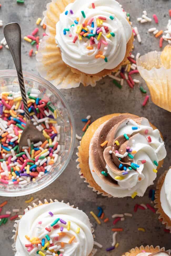 Several cupcakes with frosting and colored sprinkles for how many tablespoons in 3/4 cup.