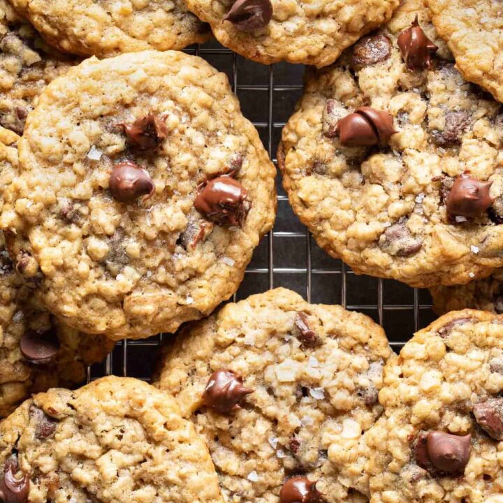 Several Oatmeal Chocolate Chip Cookies on a cooling rack.